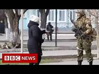 Video thumbnail for Ukrainian woman confronts armed Russian soldier - BBC News